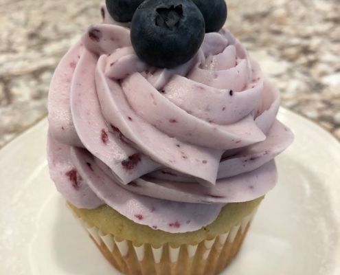 Boothbay Blue Cupcake: Lemon cupcake with blueberry cream cheese buttercream and blueberries