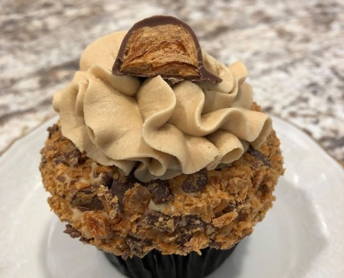 Butterfingers Cupcake: Chocolate cupcake with peanut butter buttercream, topped with Butterfinger candy