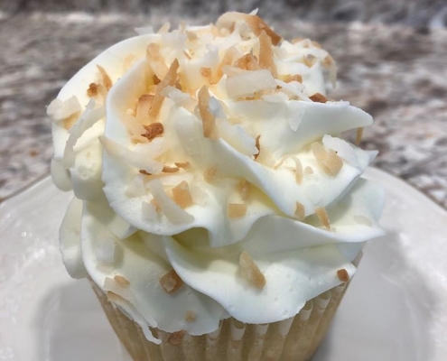 Coconut Confection Cupcake: Coconut cupcake with coconut buttercream and toasted coconut