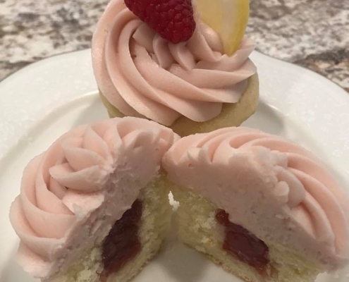 Lemon Berry Bliss Cupcake: Lemon cupcake with raspberry filling, raspberry buttercream and a raspberry