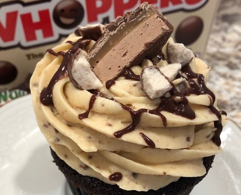 Mackworth Milky Way Cupcake: Chocolate cupcake with caramel buttercream, chocolate ganache drizzle, malted milk balls and a Milky Way bar slice