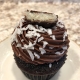 Mount Desert Mounds Cupcake: Chocolate cupcake with dark chocolate buttercream, coconut and a Mounds bar slice