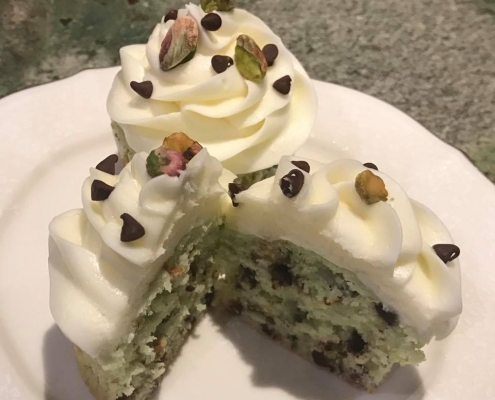 Pretty Pistachio Cupcake: Pistachio chocolate chip cupcake with cream cheese buttercream, mini chocolate chips and chopped pistachios