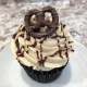 Salty Sweet Cupcake: Chocolate cupcake with salted caramel buttercream, chocolate ganache drizzle and a chocolate-covered pretzel