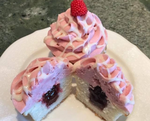 Sugarloaf Swirl Cupcake: Vanilla cupcake with raspberry filling, raspberry buttercream and a raspberry