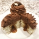 Twix Tribute Cupcake: Vanilla cupcake with caramel filling, chocolate buttercream and Twix candy