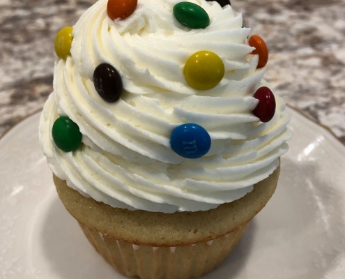 Birthday Party Cupcake: Yellow cupcake with vanilla buttercream and mini M&Ms