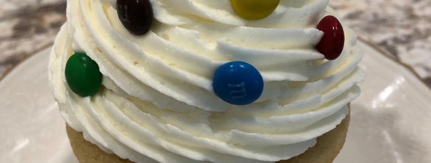 Birthday Party Cupcake: Yellow cupcake with vanilla buttercream and mini M&Ms