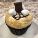 Camper Cupcake: Chocolate cupcake with marshmallow buttercream, graham cracker crumbs, chocolate ganache drizzle, marshmallows and a chocolate bar