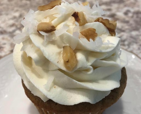 Grandpa's Classic Cupcake: Oatmeal cupcake with brown sugar cream cheese buttercream, coconut and chopped walnuts