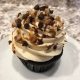 Turtle Cupcake: Chocolate cupcake with caramel buttercream, chocolate ganache drizzle, caramel sauce drizzle and pecans (or chocolate chips for nut-free option)