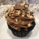 Baxter Baby Cupcake: Chocolate cupcake with chocolate buttercream, caramel sauce drizzle, chopped peanuts and a Baby Ruth bar slice