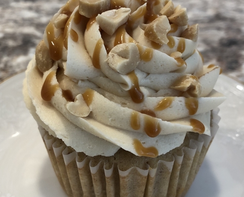 Caramel Apple Cupcake: Apple spice cupcake with salted caramel buttercream, caramel sauce drizzle and chopped peanuts (nuts optional)