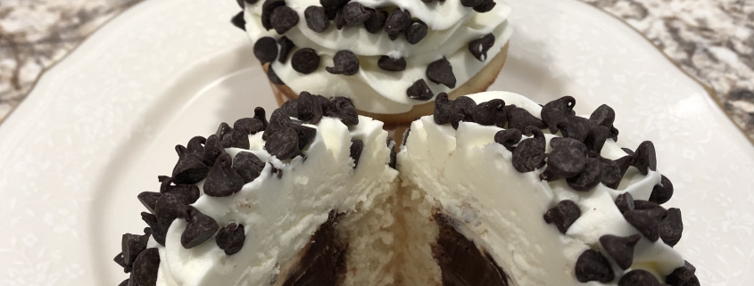 Chocolate Chip Charm Cupcake: Vanilla cupcake with chocolate ganache filling, vanilla buttercream and mini chocolate chips