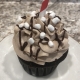 Cozy Cocoa Cupcake: Chocolate cupcake with hot cocoa buttercream, chocolate ganache drizzle and marshmallow bits