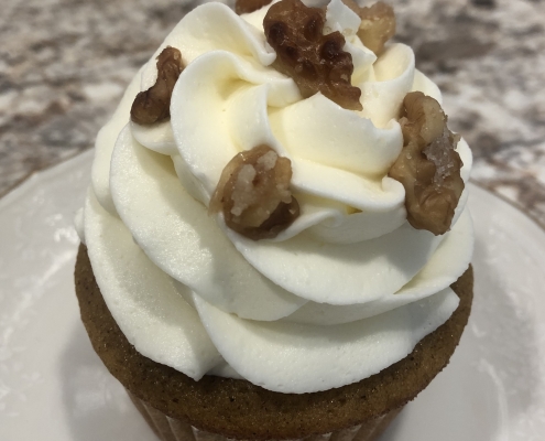 Perfect Pumpkin Cupcake: Pumpkin spice cupcake with cream cheese buttercream and candied walnuts
