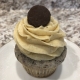 Pumpkin Oreo Cheesecake Cupcake: Cookies-n-creme cupcake with pumpkin cream cheese buttercream and a mini chocolate covered Oreo