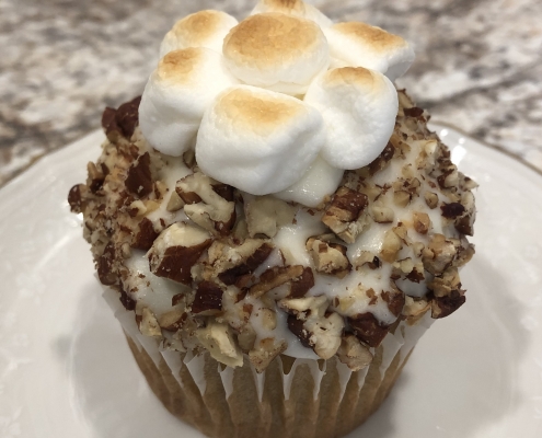 Sweet Potato Pie Cupcake: Sweet potato cupcake with marshmallow buttercream, chopped pecans and toasted marshmallows