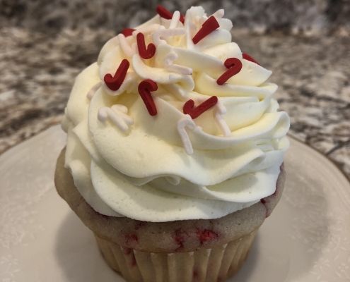 Candy Cane Cupcake: Vanilla red Funfetti cupcake with peppermint buttercream and candy cane sprinkles