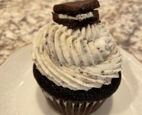 Cookie Monster Cupcake: Chocolate cupcake with cookies-n-creme buttercream, topped with a chocolate covered Oreo