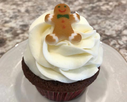 Gingy Cupcake: Gingerbread cupcake with cream cheese buttercream and a gingerbread cookie