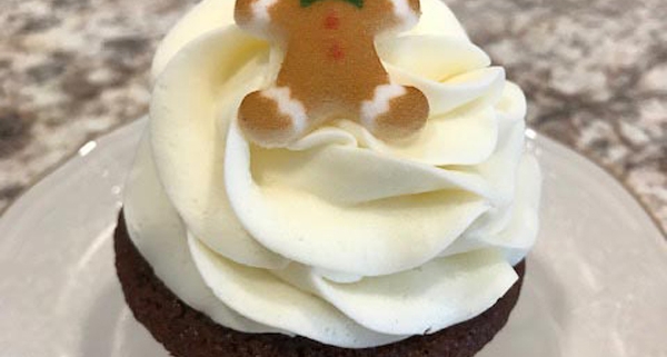 Gingy Cupcake: Gingerbread cupcake with cream cheese buttercream and a gingerbread cookie