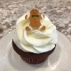 Gingy Cupcake: Gingerbread cupcake with cream cheese buttercream and a gingerbread cookie