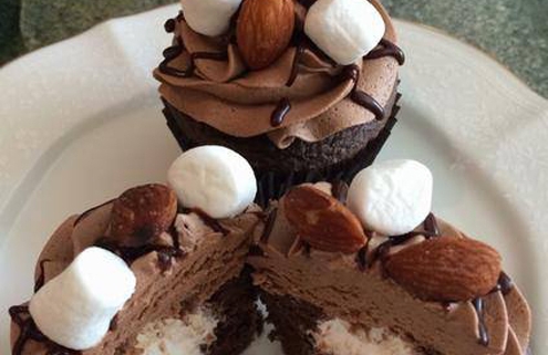 Rocky Trails Cupcake: Chocolate cupcake with marshmallow filling, chocolate buttercream, chocolate ganache drizzle, almonds and mini marshmallows