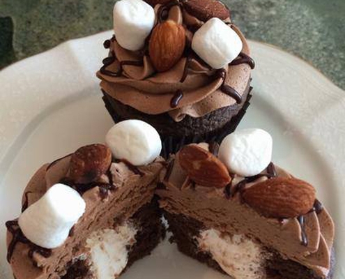 Rocky Trails Cupcake: Chocolate cupcake with marshmallow filling, chocolate buttercream, chocolate ganache drizzle, almonds and mini marshmallows