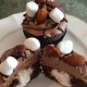 Rocky Trails Cupcake: Chocolate cupcake with marshmallow filling, chocolate buttercream, chocolate ganache drizzle, almonds and mini marshmallows