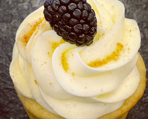 Blue Hill Blackberry Cupcake: Lemon cupcake with blackberry jam filling, cream cheese buttercream, graham cracker crumbs and a blackberry