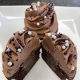 Midnight Magic Cupcake: Chocolate cupcake with chocolate ganache filling, dark chocolate buttercream and sprinkles