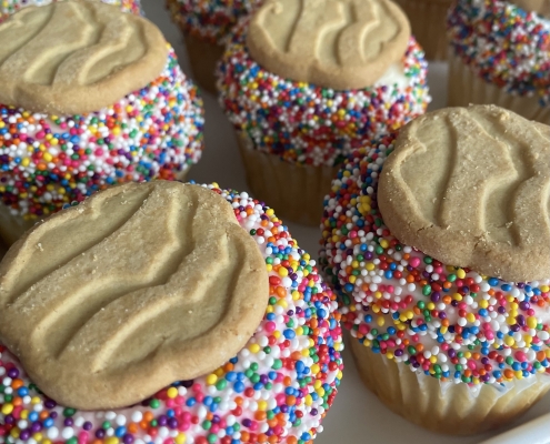 Trefoil Cupcakes: Vanilla cupcake with Vanilla buttercream, sprinkles and a cookie