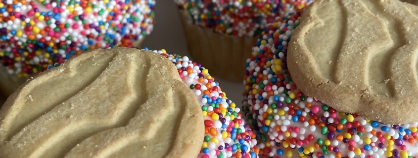 Trefoil Cupcakes: Vanilla cupcake with Vanilla buttercream, sprinkles and a cookie