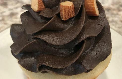 Almond Affair Cupcake: Almond cupcake with dark chocolate buttercream and chopped almonds