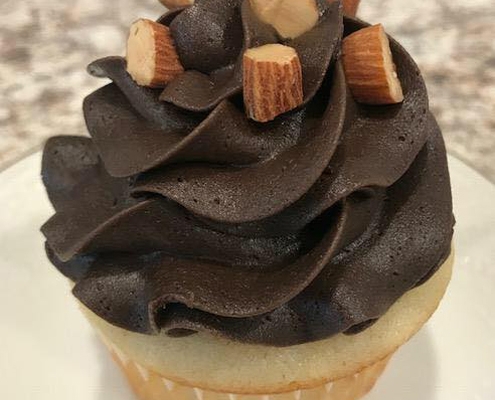 Almond Affair Cupcake: Almond cupcake with dark chocolate buttercream and chopped almonds